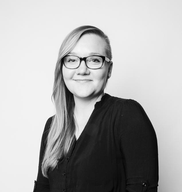 headshot of assistant professor clare benson, shot in black and white